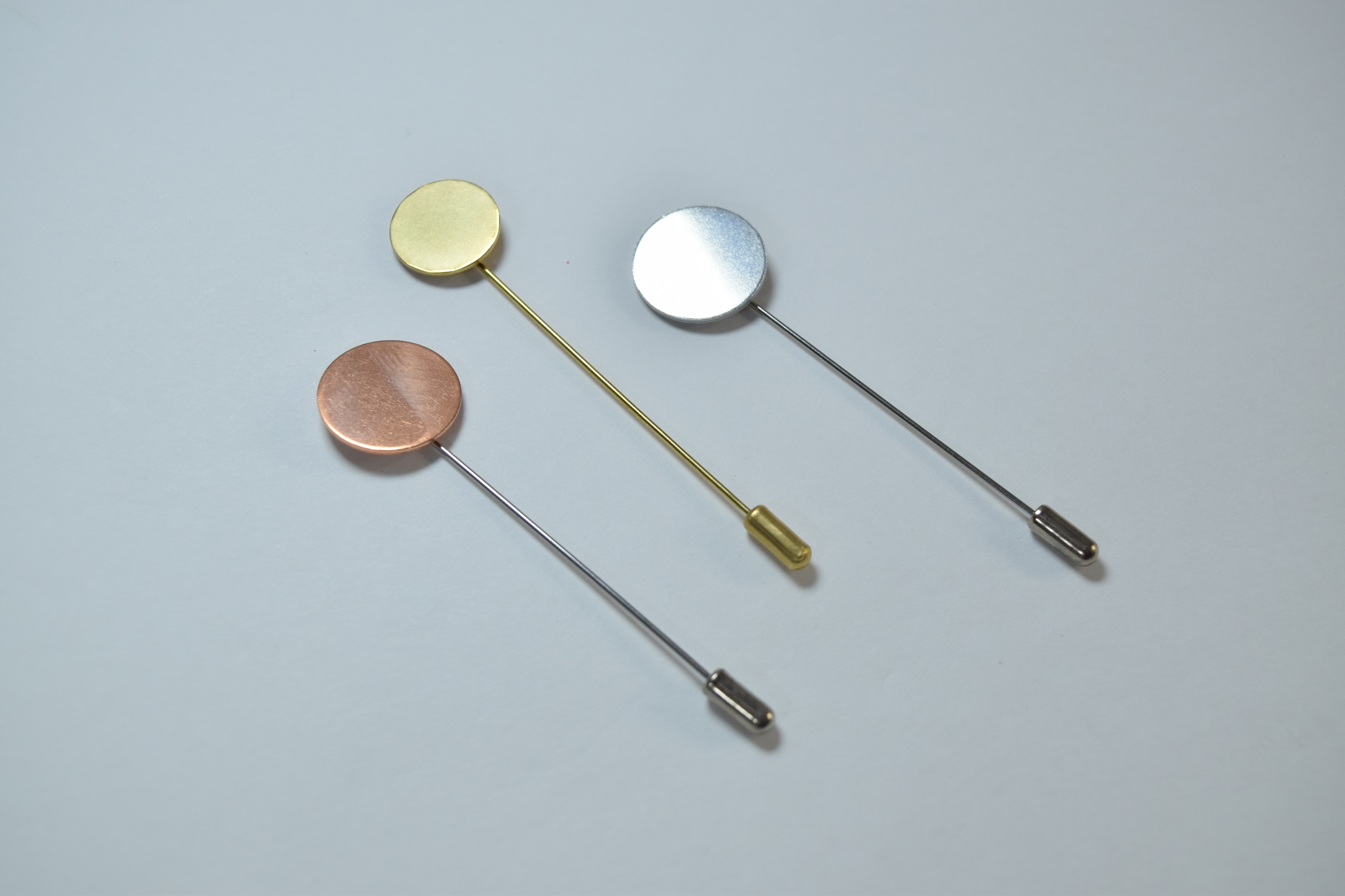 copper brass and aluminum round lapel pins