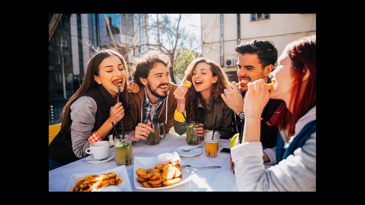 Image of people sitting at a table at an outdoor restuarant