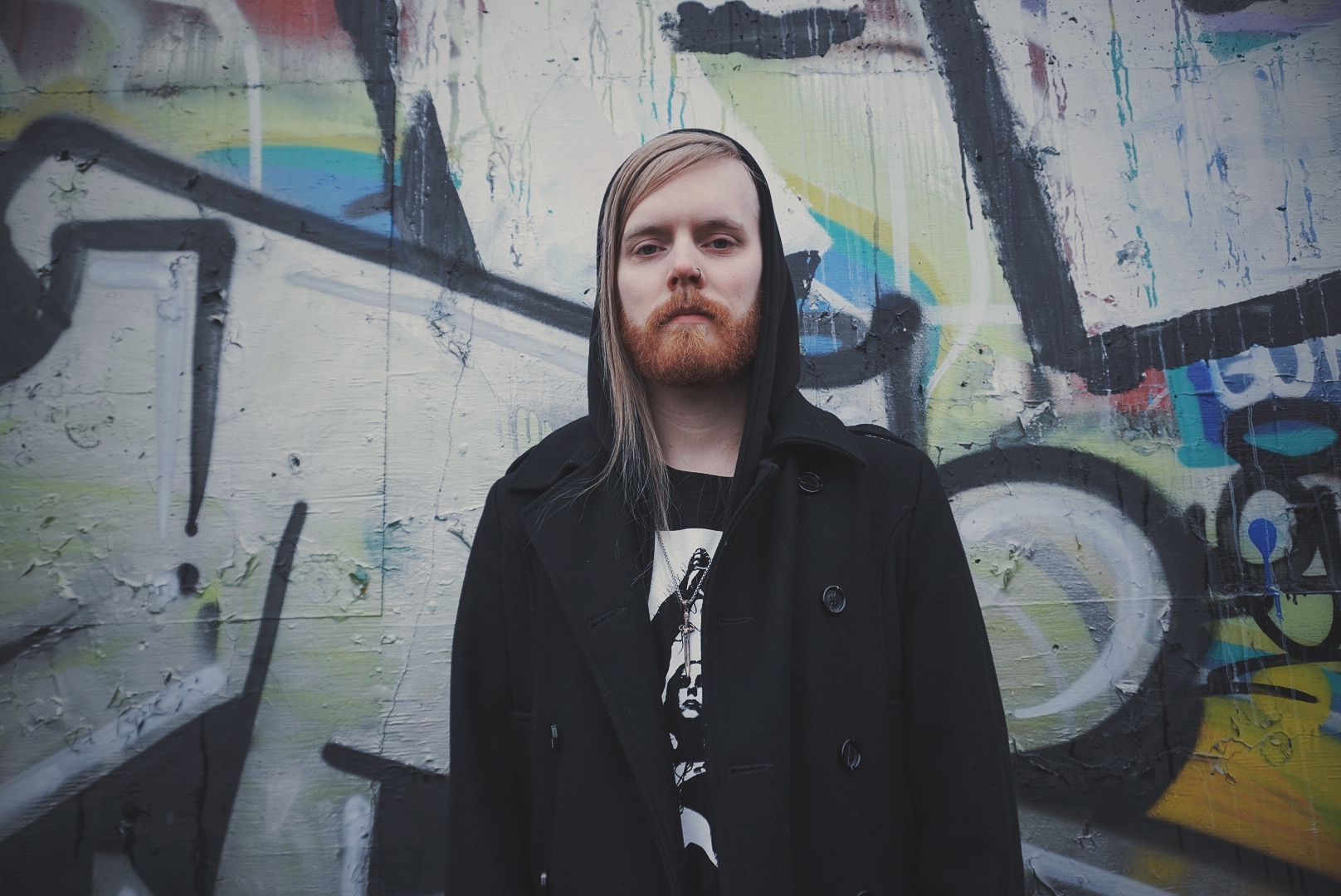 photo of cole rideout against a graffiti wall