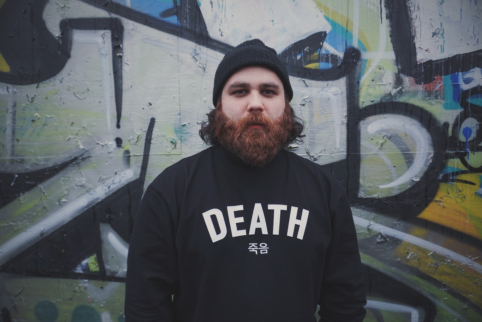 photo of johnny ciardullo against a graffiti wall