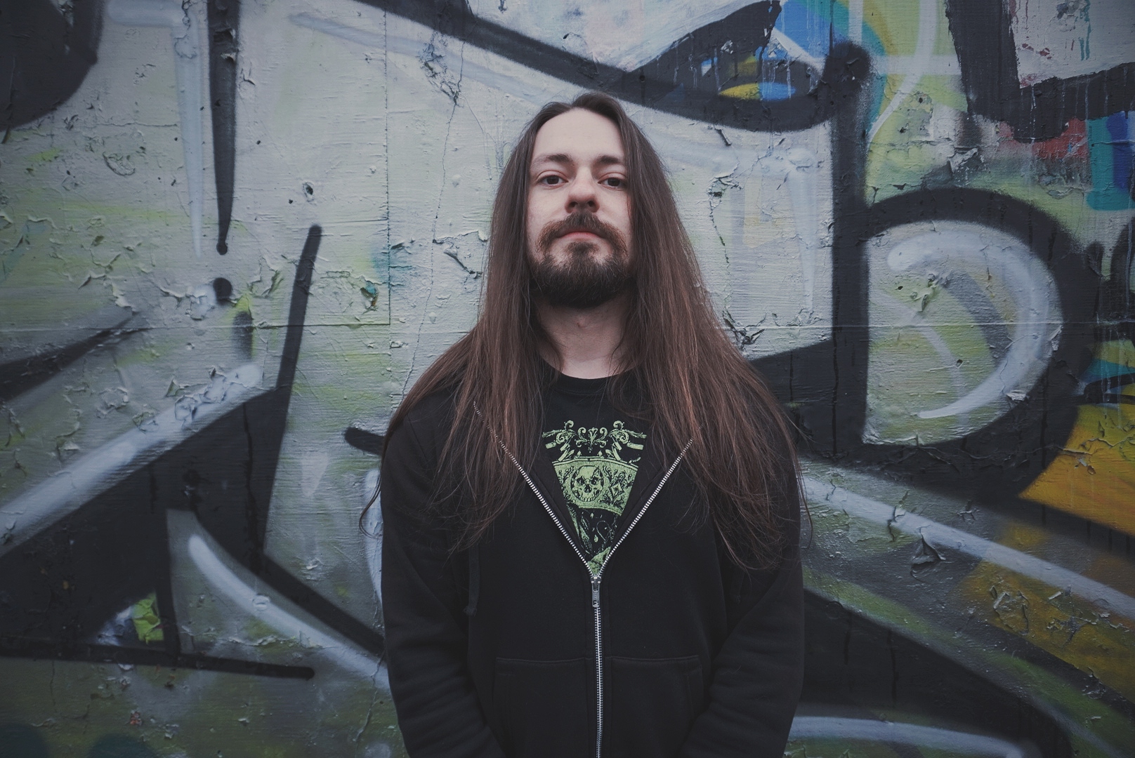 photo of matt perrin against a graffiti wall